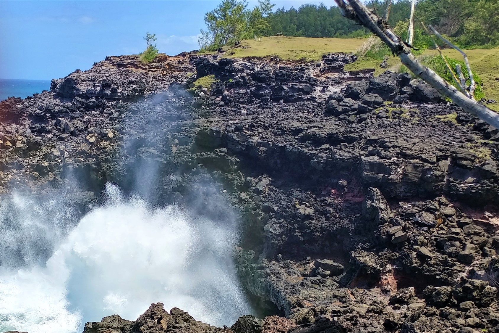 waves crashing against cliff