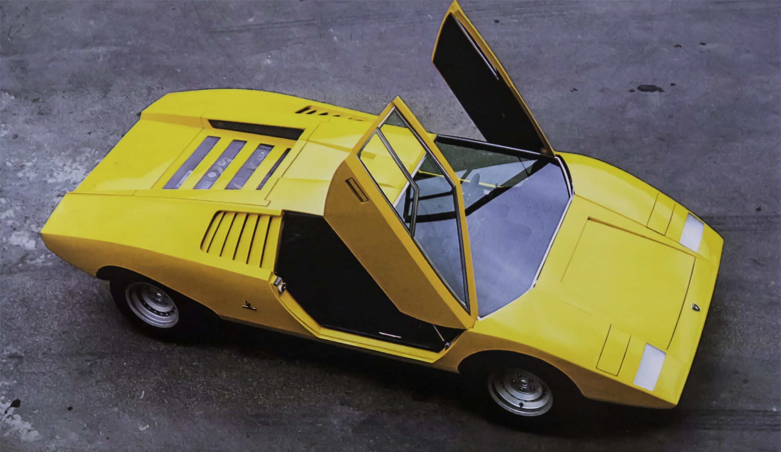 View from top of Mark 1 yellow Lamborghini Countach LP-500 with suicide lambo doors open