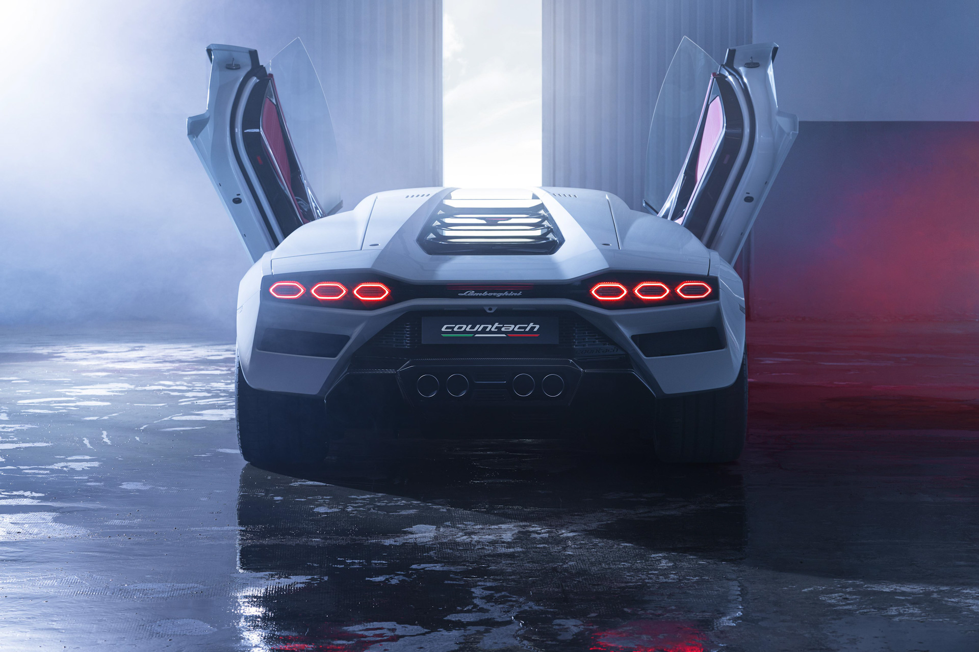 white 2022 Lamborghini Countach rear view with open scissor doors 